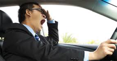 Man Yawning While Driving